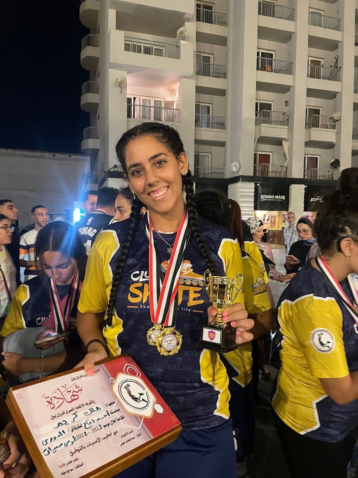 A player with her medals and trophy